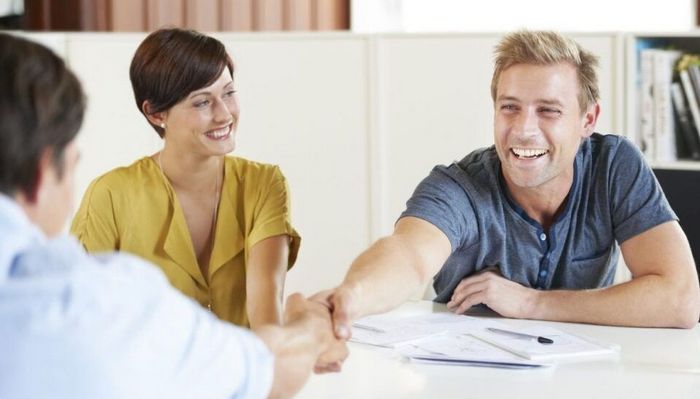 Factory Credit Counseling - Two Persons Handshaking With Happy Faces