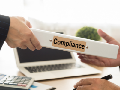 Expert Financial Management Consultancy Services | Lotus Advisory UAE Financial Advisory Services in UAE - Man Giving Compliance File to Another Man